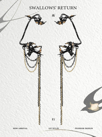 Elegant swallow ear clips featuring intricate design and chains for a unique accessory look