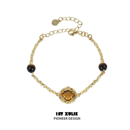 Elegant tiger eye shell silver bracelet with intricate design and adjustable chain for versatile wear