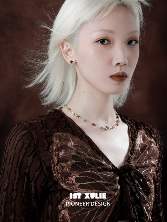 Elegant tiger's eye necklace for women showcased on a model with a stylish outfit