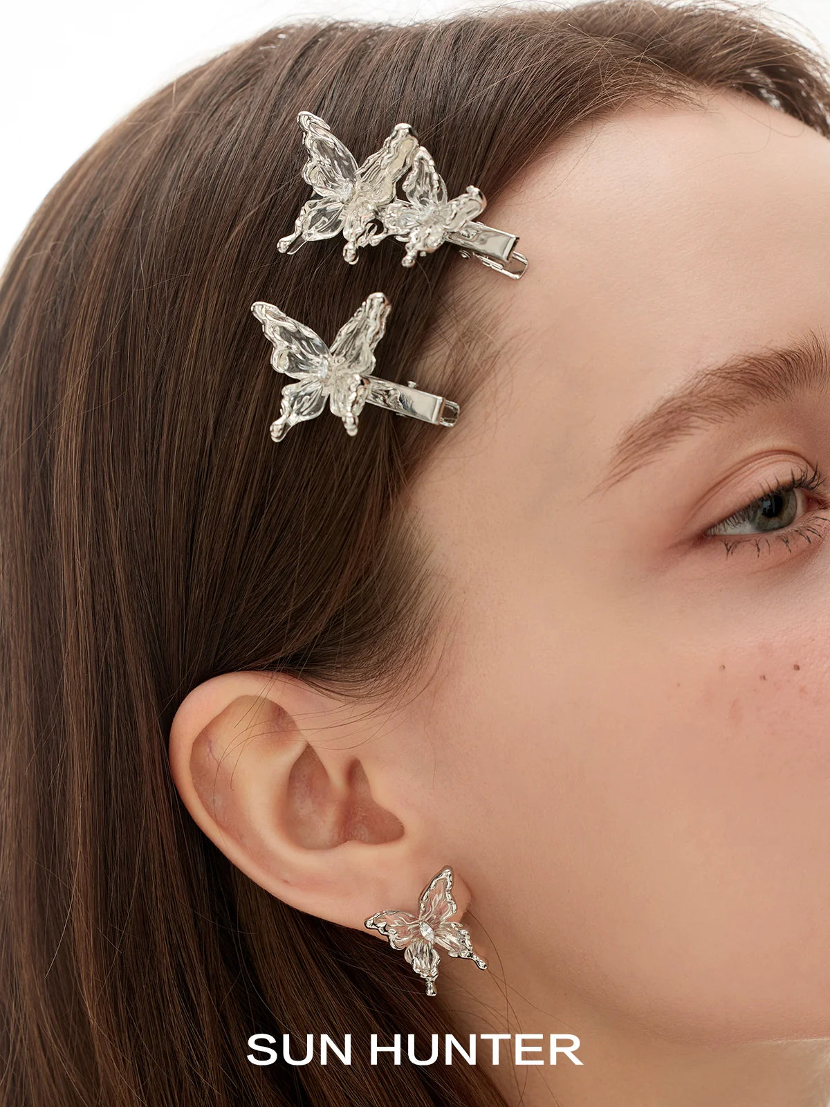 SUN HUNTER transparent butterfly earrings with sparkly details for a stylish accessory look