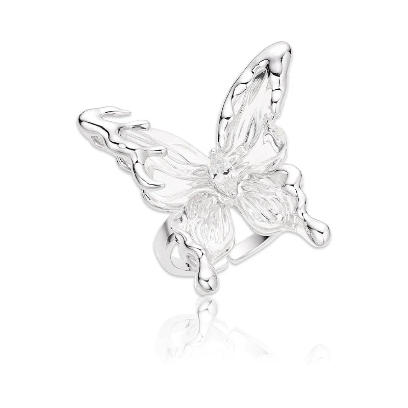 Elegant transparent butterfly earrings by SUN HUNTER featuring intricate design and sparkling accents
