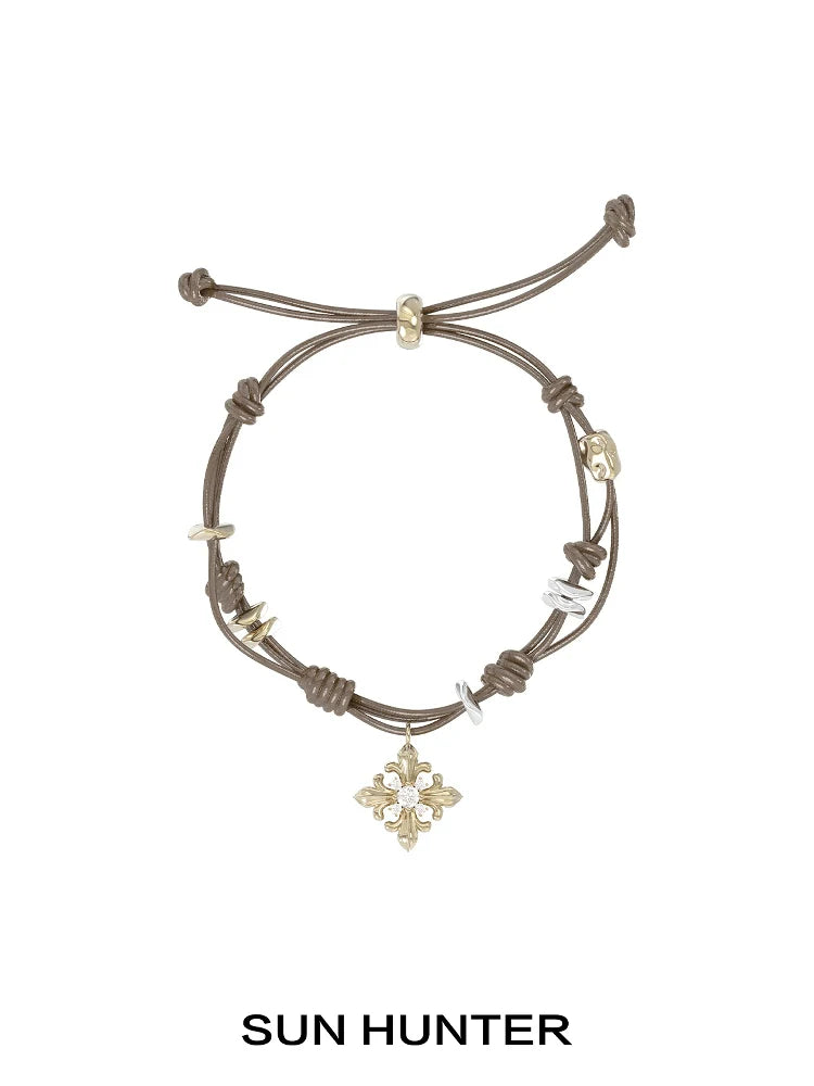 SUN HUNTER Twilight Iris braided bracelet with decorative charms and adjustable closure