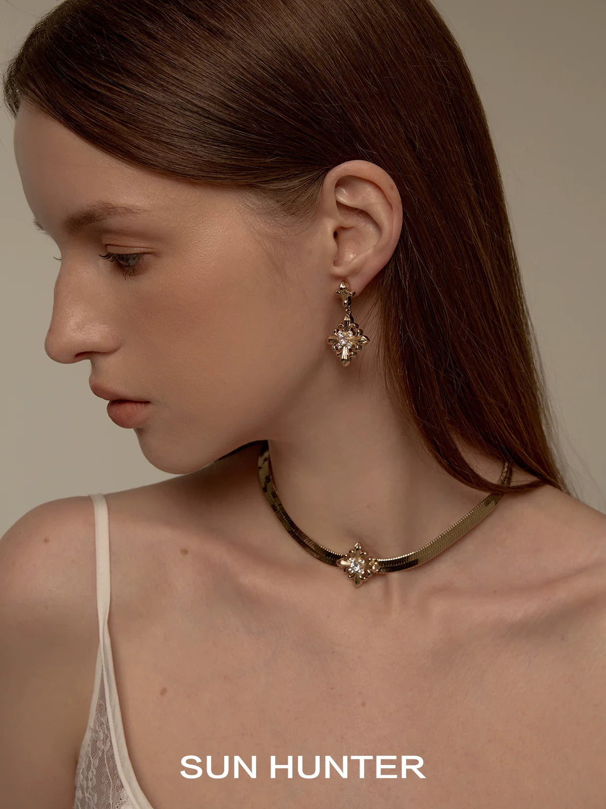 Unique floral drop earrings by SUN HUNTER showcased on a model with elegant style