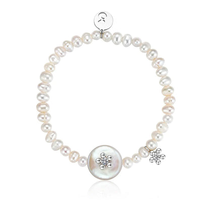 SUN HUNTER unique pearl bracelet featuring a charming floral charm and a large central pearl