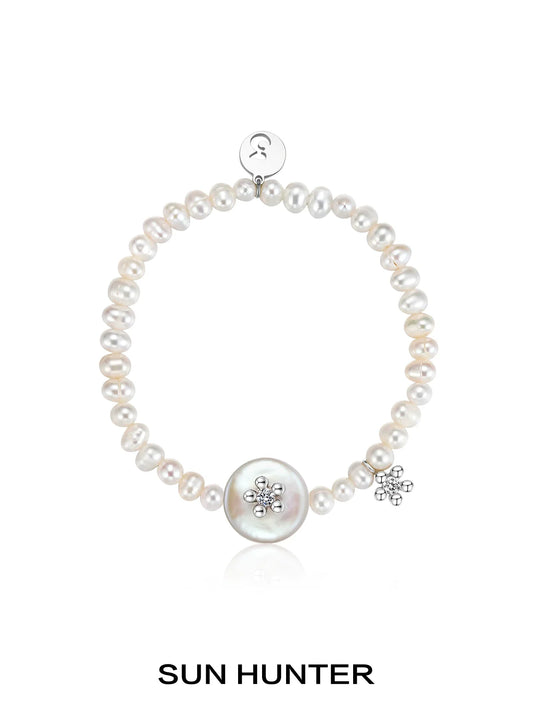 SUN HUNTER unique pearl bracelet featuring a large centerpiece and sparkling accents