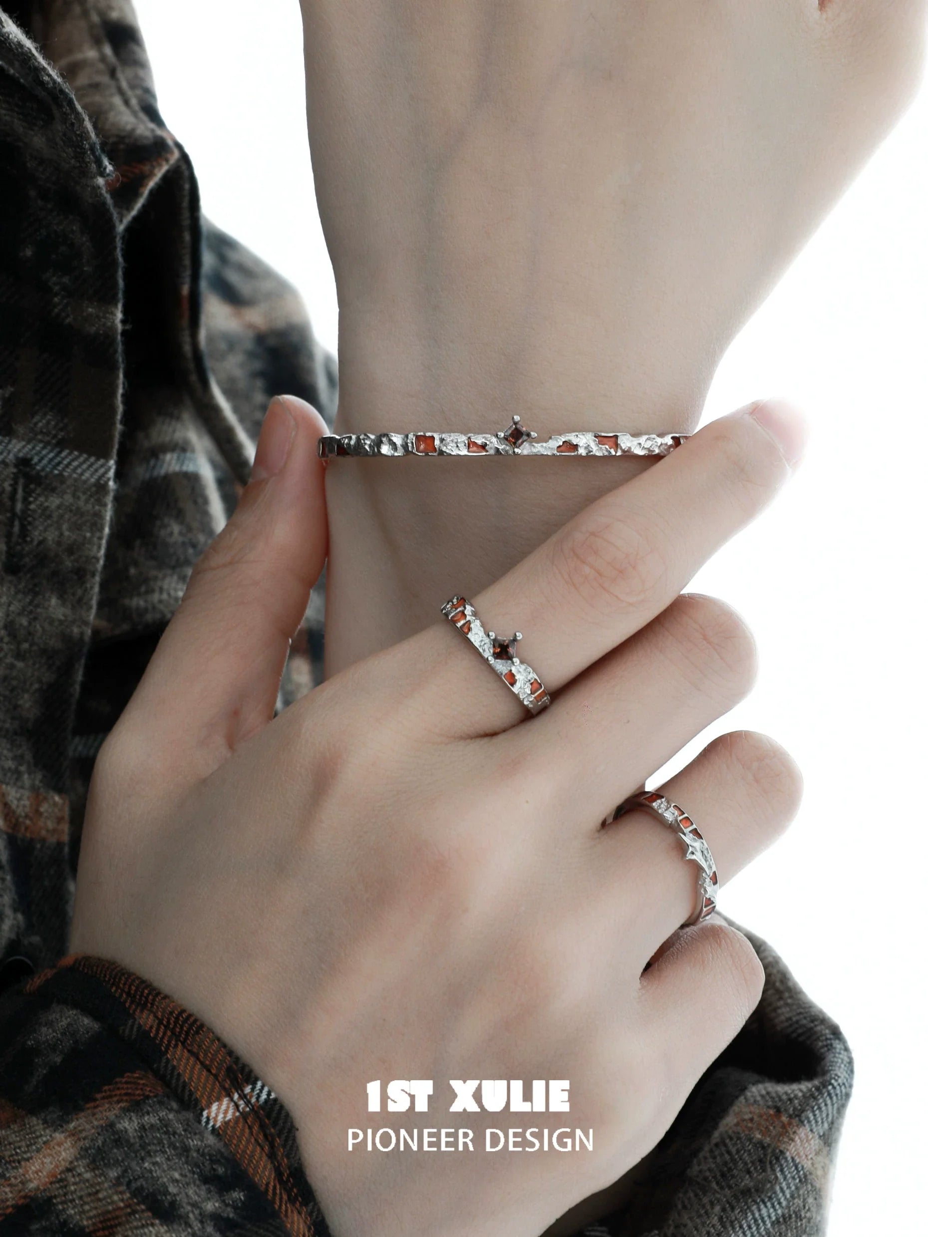 Unique silver bracelet for women worn on a hand, featuring an elegant design with subtle details