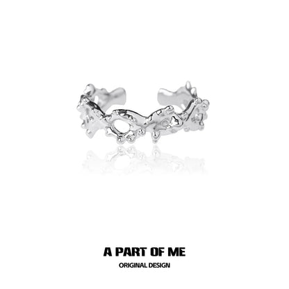 Unique silver ring by A PART OF ME featuring an artistic design with textured details
