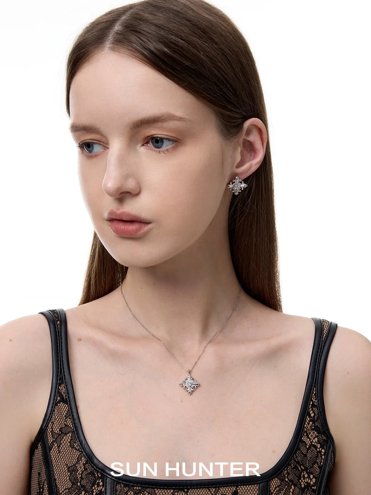 Beautiful model wearing unique square stud earrings by SUN HUNTER for a stylish look