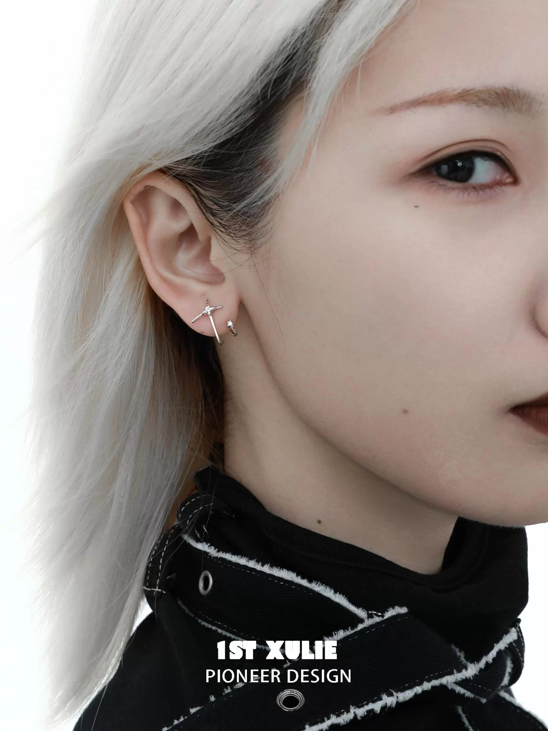 Stylish model wearing unique zircon stud earrings for a chic and modern look