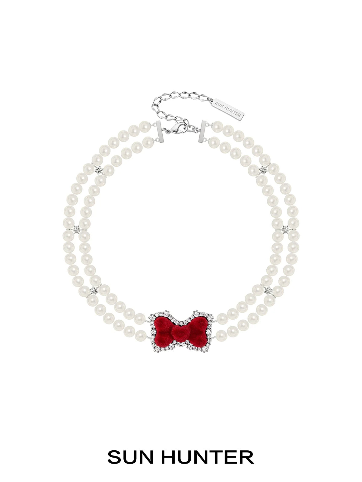 Elegant SUN HUNTER velvet bow pearl bracelet featuring a red bow and pearl beads