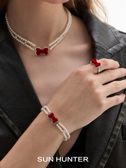 SUN HUNTER velvet bow pearl bracelet featuring red velvet bow and elegant pearl accents