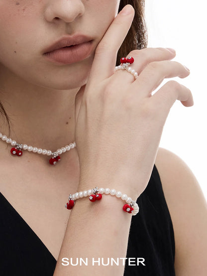 Elegant SUN HUNTER velvet cherry pearl bracelet with red cherries and pearls for a chic look