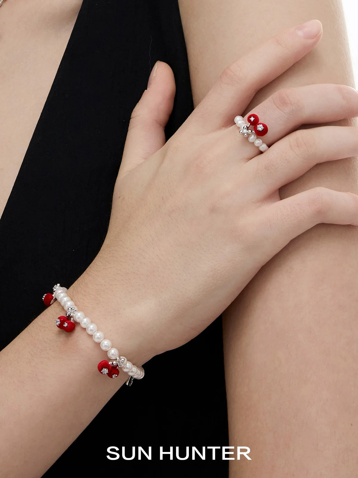 Elegant velvet cherry pearl bracelet by SUN HUNTER featuring red and white pearls for a stylish look