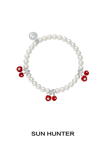 SUN HUNTER velvet cherry pearl bracelet featuring red cherry charms and shimmering pearls
