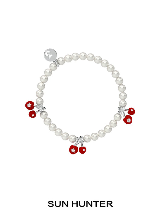 SUN HUNTER velvet cherry pearl bracelet featuring red cherry charms and shimmering pearls