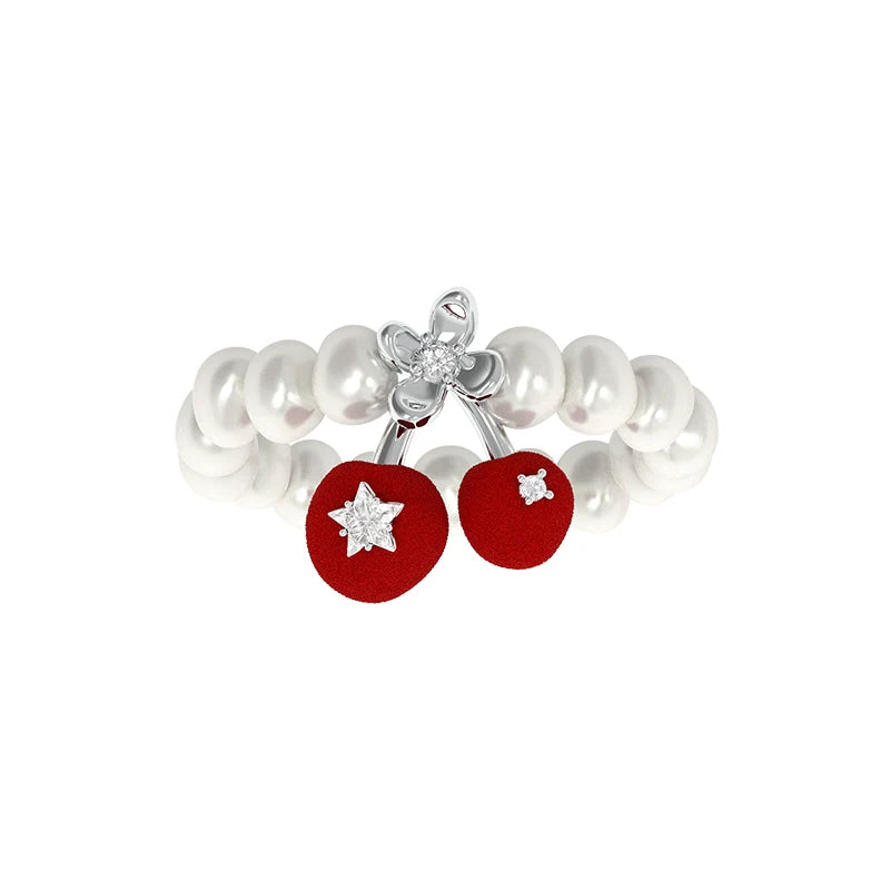 SUN HUNTER velvet cherry pearl ring featuring red cherries and elegant pearl accents