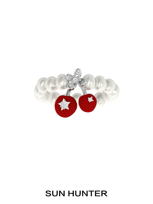 SUN HUNTER velvet cherry pearl ring featuring a red cherry design with pearl accents