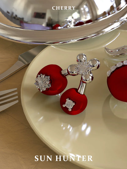 SUN HUNTER velvet cherry stud earrings featuring elegant designs and sparkling accents