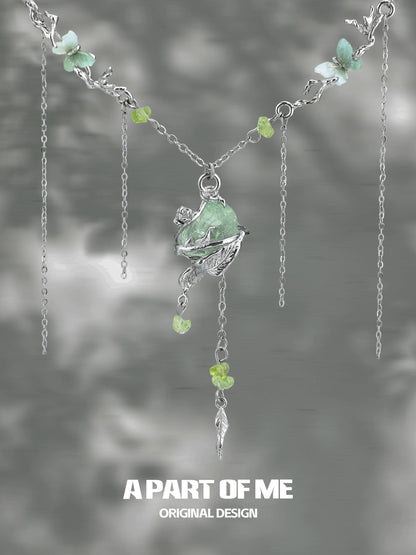 A PART OF ME forest fairy fluorite necklace featuring silver chain, delicate charms, and colorful gemstones
