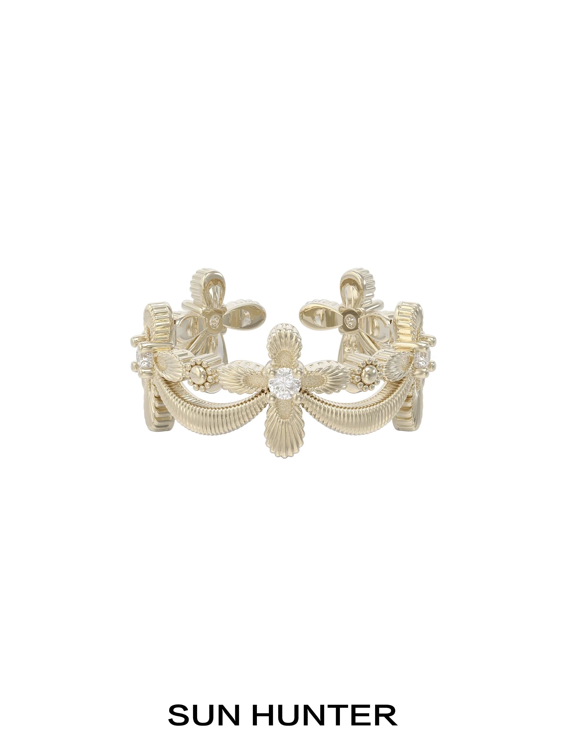 Elegant SUN HUNTER shimmer cross ring featuring intricate detailing and a sparkling center stone