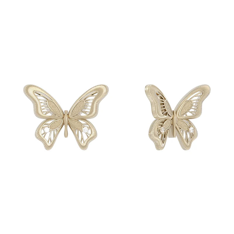Elegant SUN HUNTER vintage butterfly earrings with intricate lace detailing in gold tone
