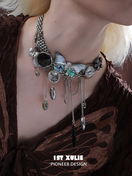 Vintage butterfly necklace featuring intricate design with silver chains and embellishments