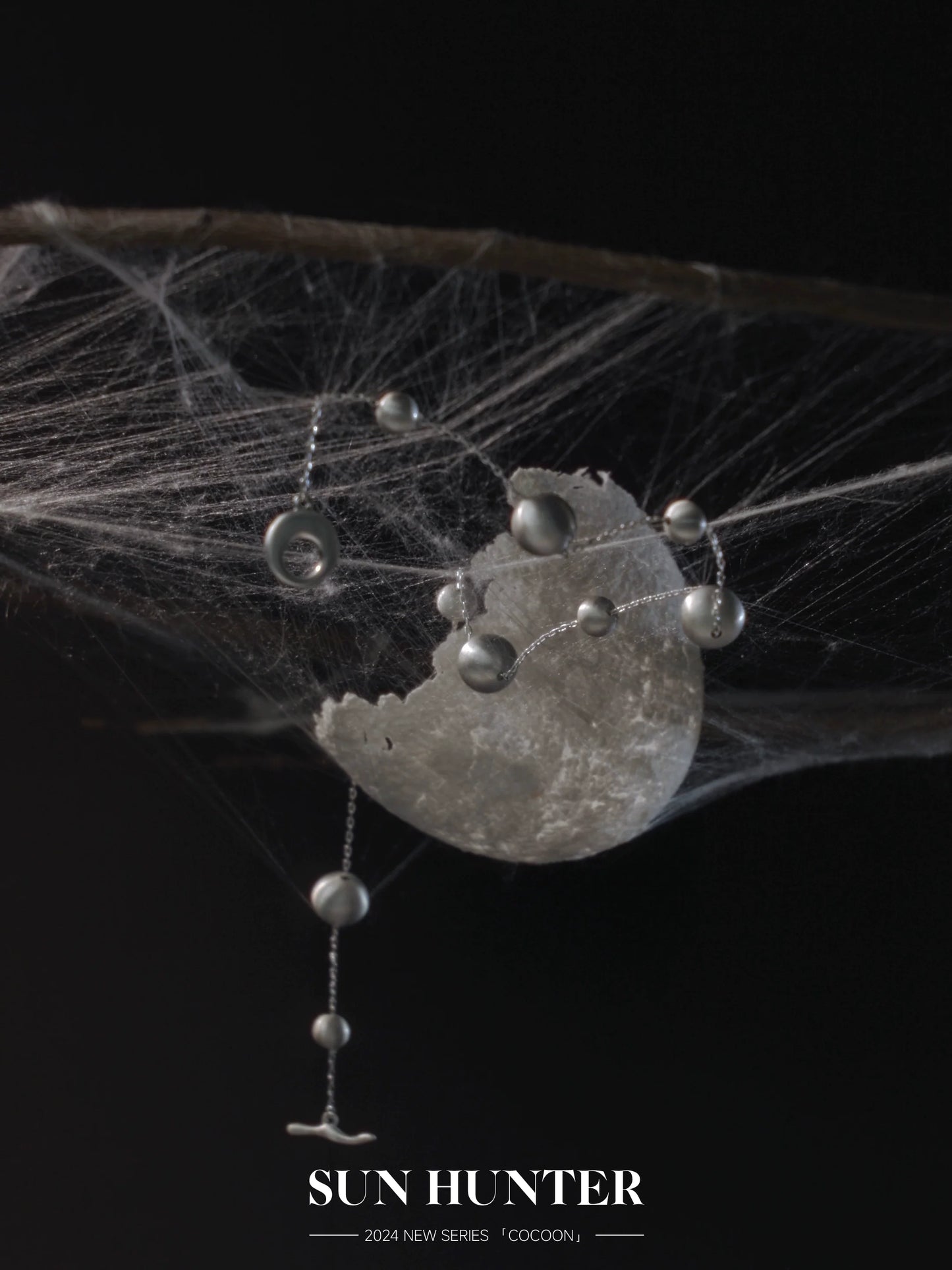 Unique vintage cocoon earrings with delicate design featuring silver accents and a modern aesthetic
