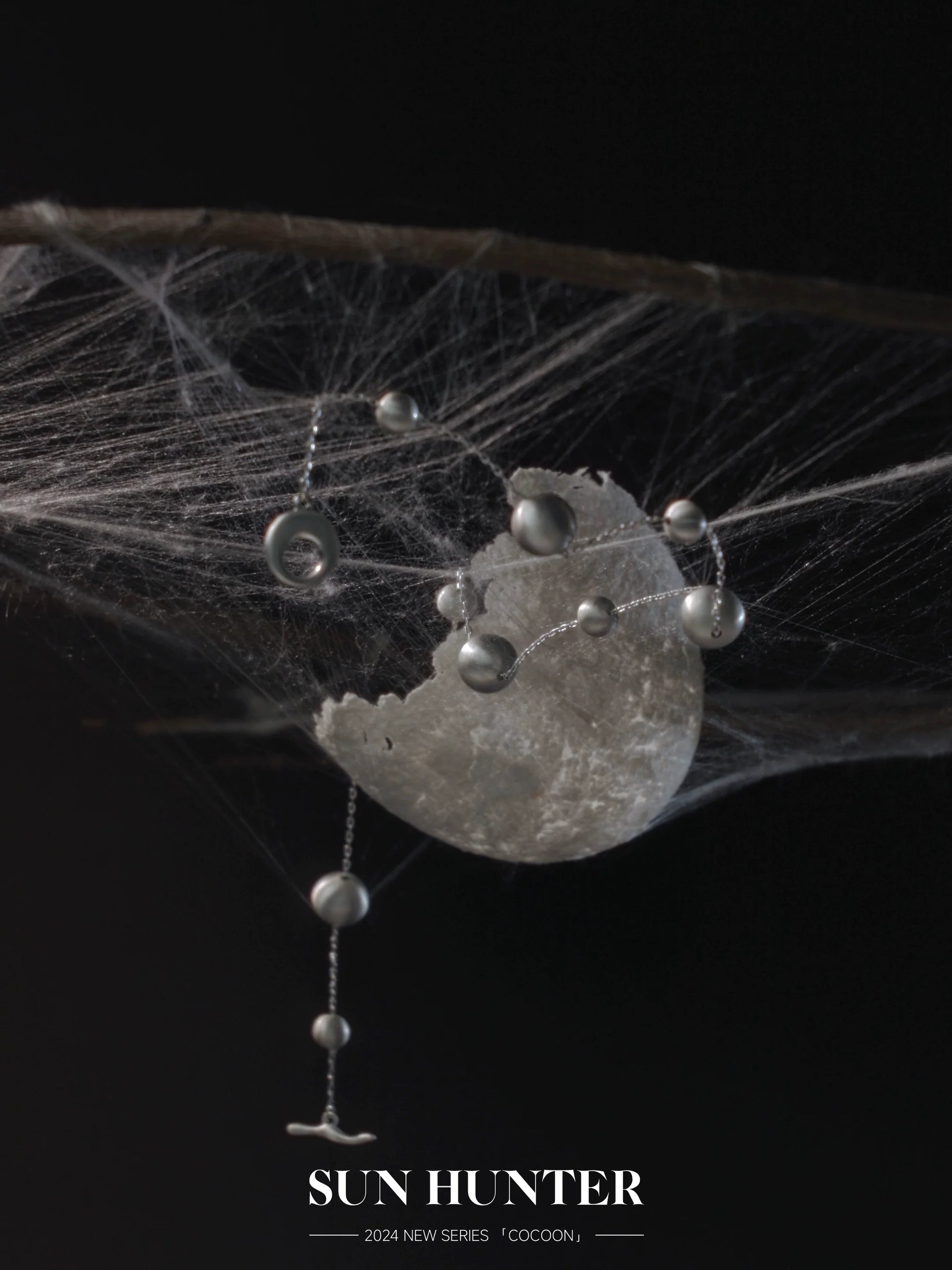 Unique vintage cocoon earrings with delicate design featuring silver accents and a modern aesthetic