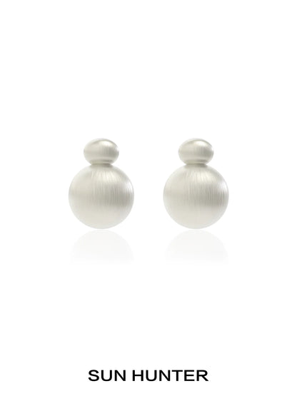 Elegant vintage cocoon earrings in soft metallic finish by SUN HUNTER, perfect for any occasion