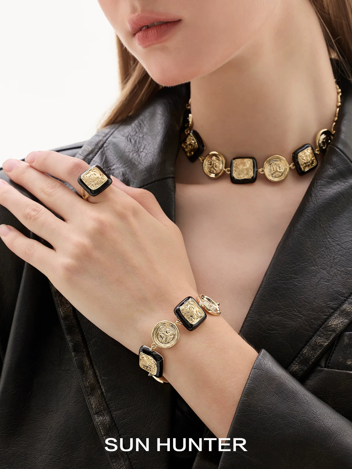 SUN HUNTER vintage coin bracelet featuring gold coins on a black band for a stylish look