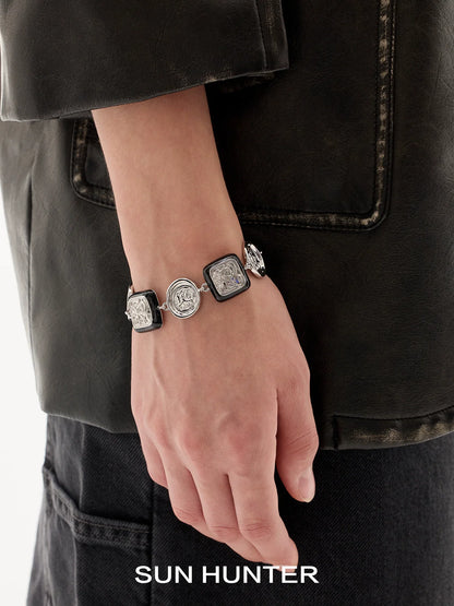 Elegant vintage coin bracelet from SUN HUNTER featuring intricate coin designs on a stylish chain