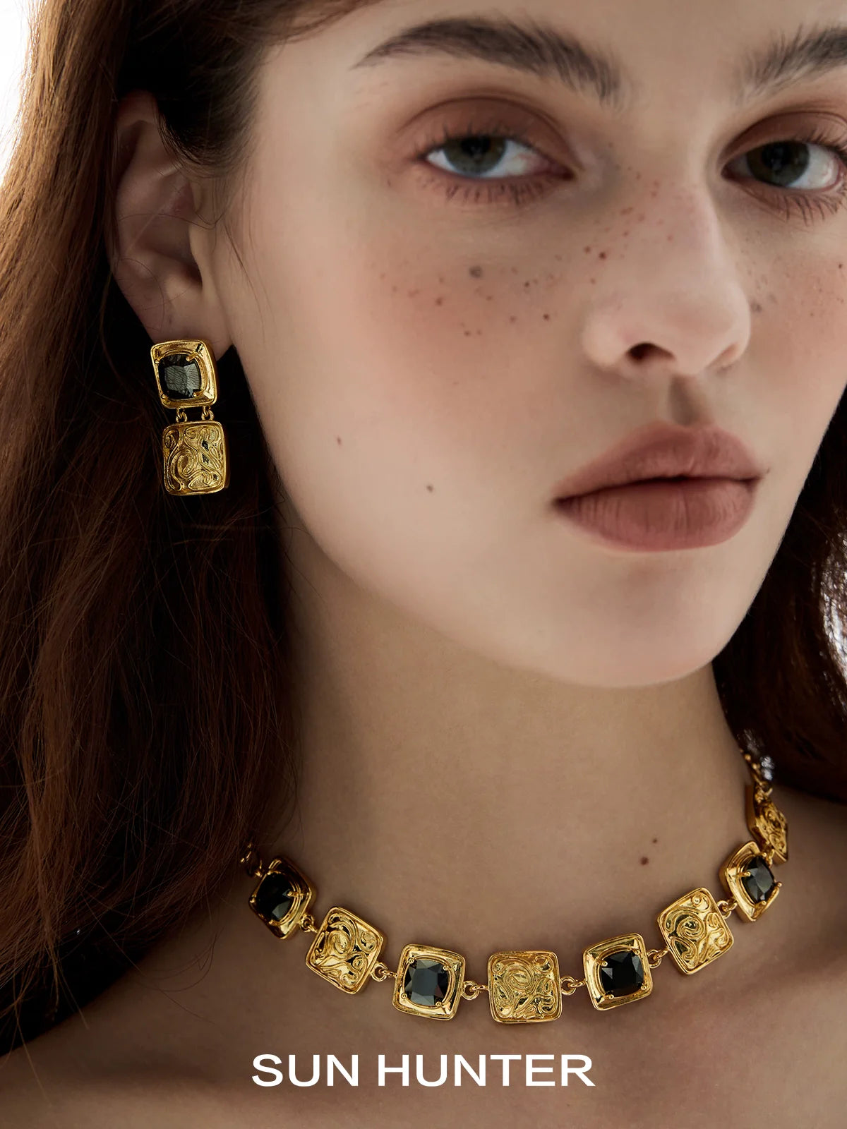 Elegant SUN HUNTER vintage coin earrings in gold with intricate detailing for a chic look