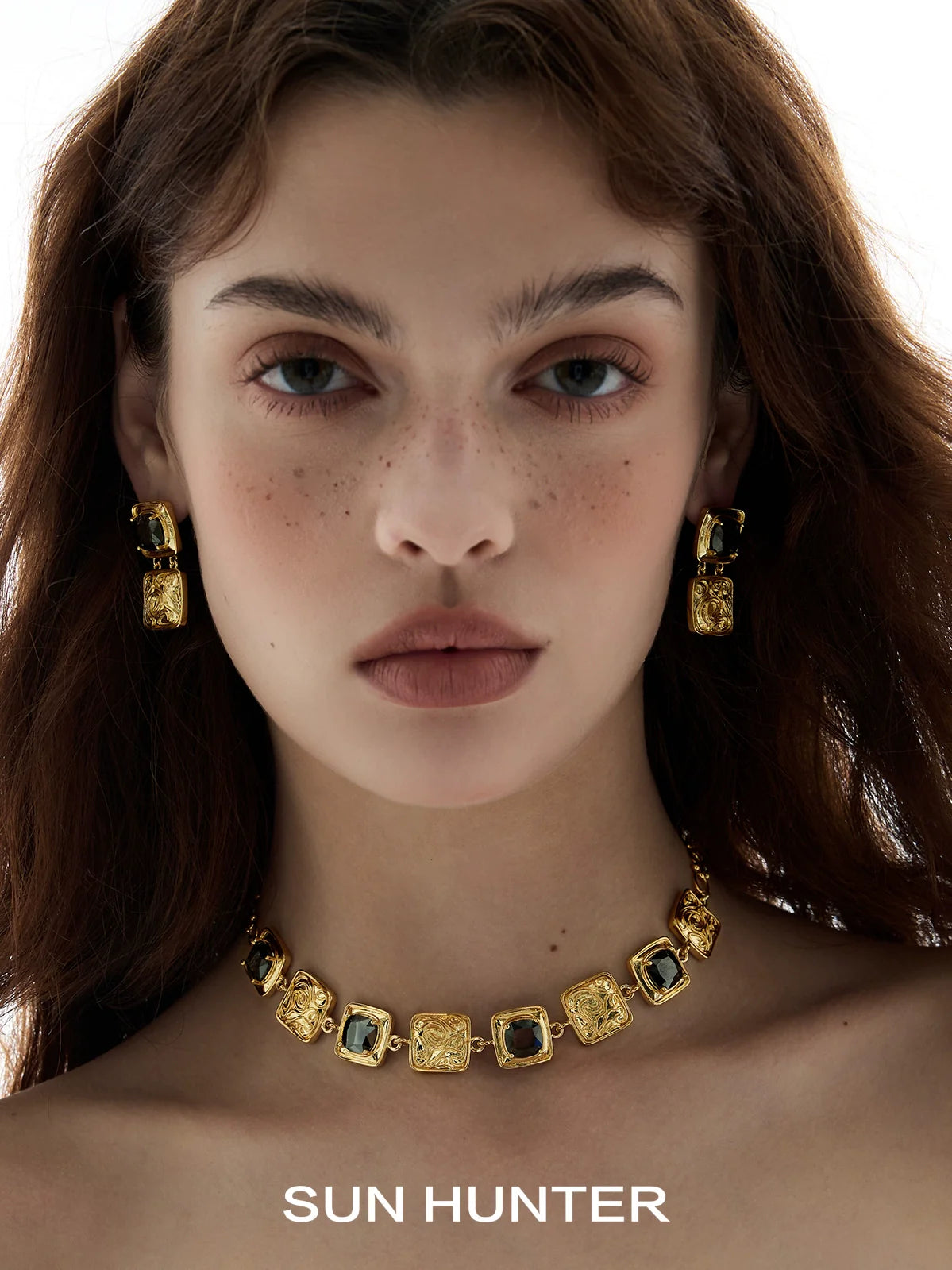 Elegant SUN HUNTER vintage coin earrings in gold with intricate designs for a stylish look