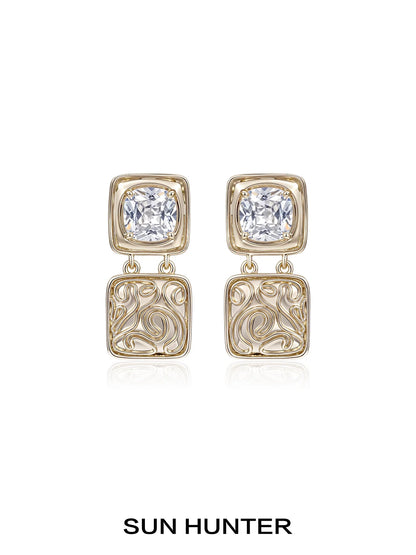 Elegant SUN HUNTER vintage coin earrings with decorative design and sparkling gemstones
