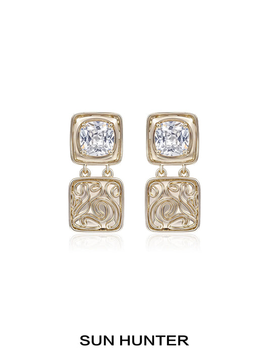 Elegant SUN HUNTER vintage coin earrings with decorative design and sparkling gemstones