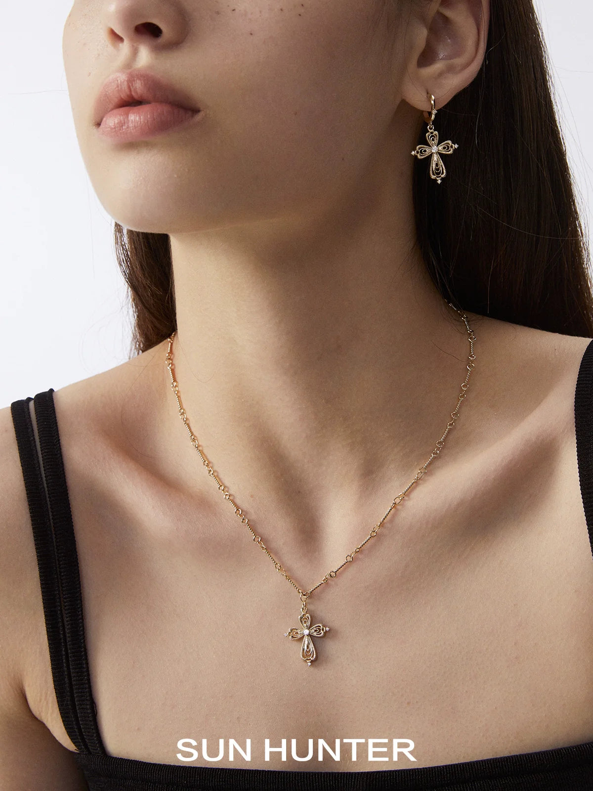 SUN HUNTER vintage cross earrings designed with elegant detailing and a stylish drop feature