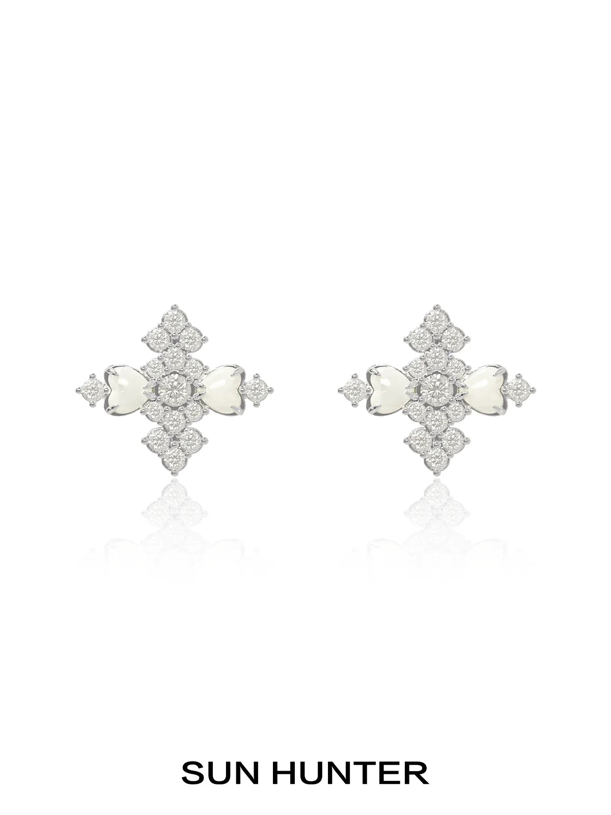 Elegant SUN HUNTER vintage cross earrings featuring intricate design and sparkling stones