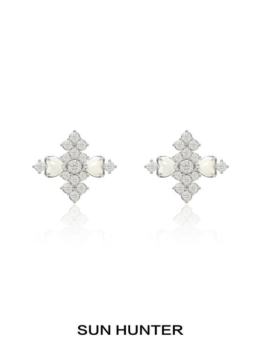Elegant SUN HUNTER vintage cross earrings featuring intricate design and sparkling stones