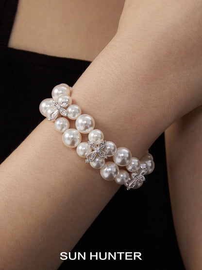 SUN HUNTER vintage cross pearl bracelet with elegant design and multiple strands of pearls