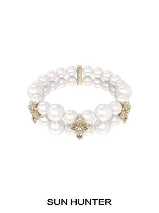 SUN HUNTER vintage cross pearl bracelet featuring elegant faux pearls and intricate cross designs