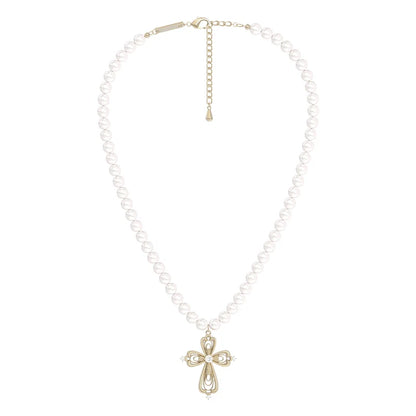 Vintage cross pearl necklace featuring a decorative cross pendant on a pearl strand