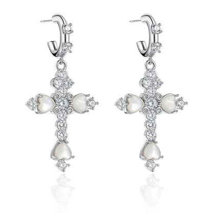 Elegant vintage cross zircon earrings featuring sparkling details and a unique design