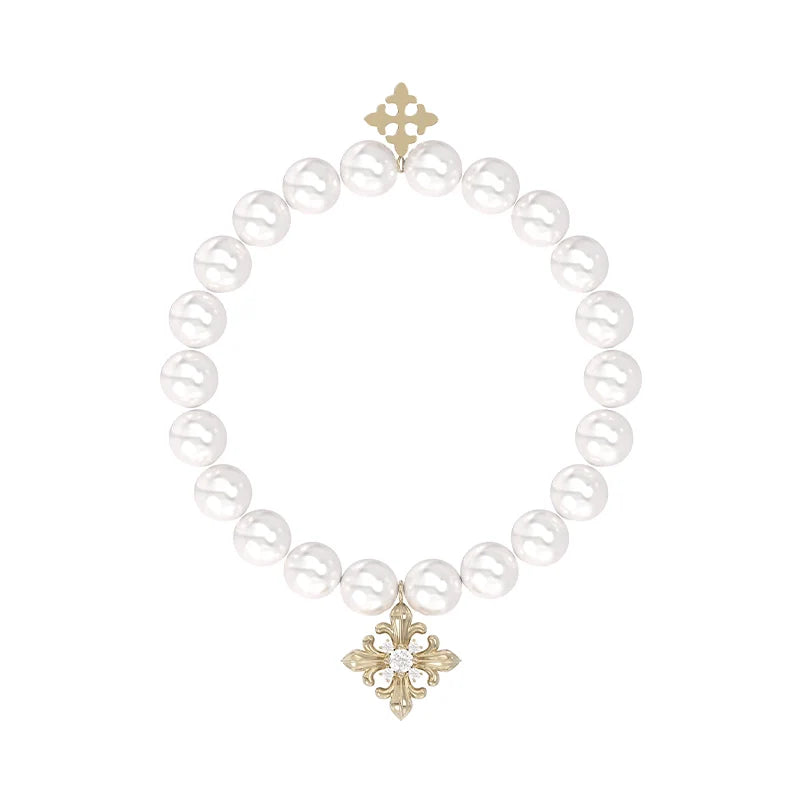 Elegant vintage iris pearl bracelet with a decorative gold charm for a timeless look