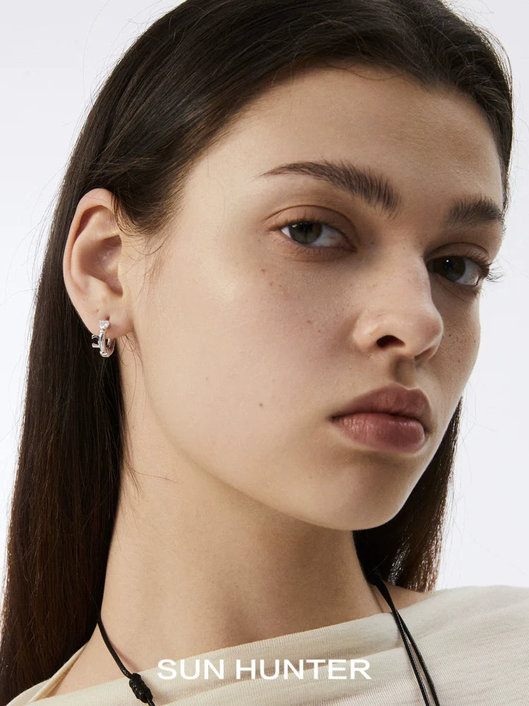 Elegant SUN HUNTER vintage lace earrings showcased on a model for a chic look