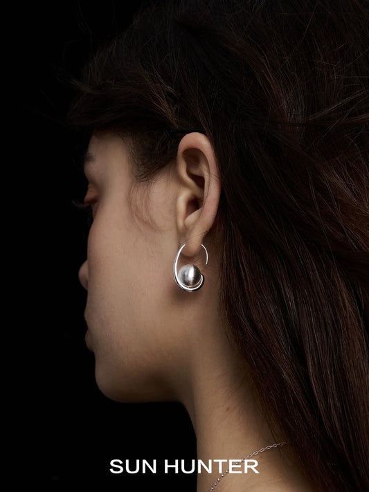 Elegant vintage orbital earrings by SUN HUNTER showcasing a unique design and stylish charm