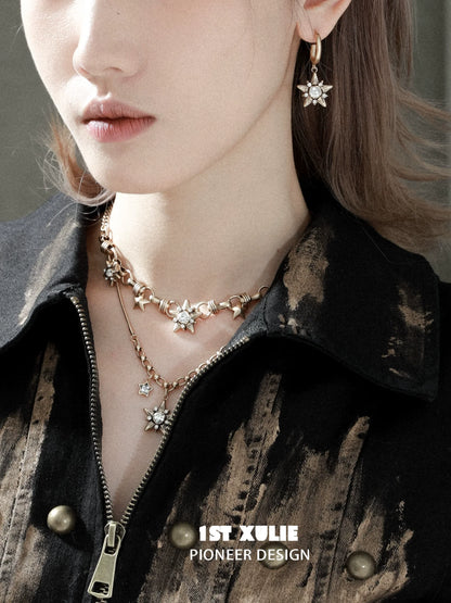 Elegant vintage starlight pendant necklace displayed with matching earrings for a chic look