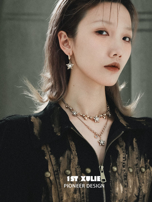 Elegant vintage starlight pendant necklace paired with matching earrings for a sophisticated look