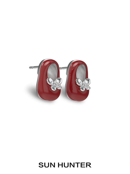 Red SUN HUNTER vintage walking shoe earrings with floral design for stylish accessory lovers