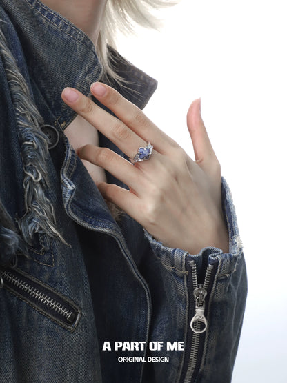 A PART OF ME violet gemstone ring showcased on a hand with a denim jacket