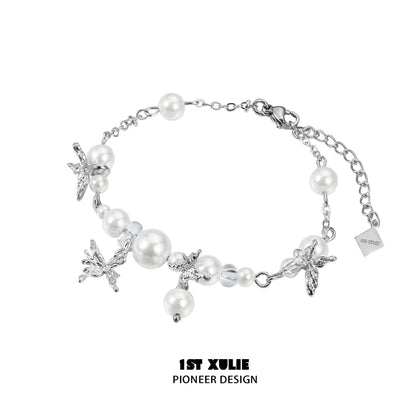 Elegant white butterfly pearl bracelet with silver accents for a chic look
